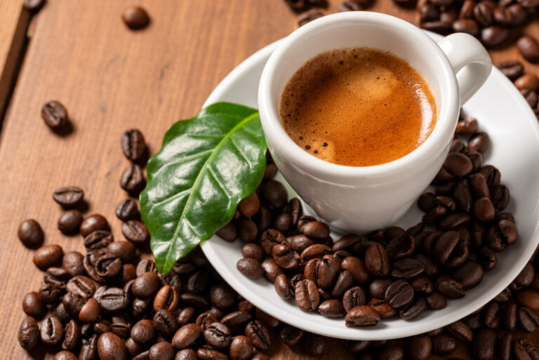 Cup of Italian Espresso Coffee with Beans and Leaf