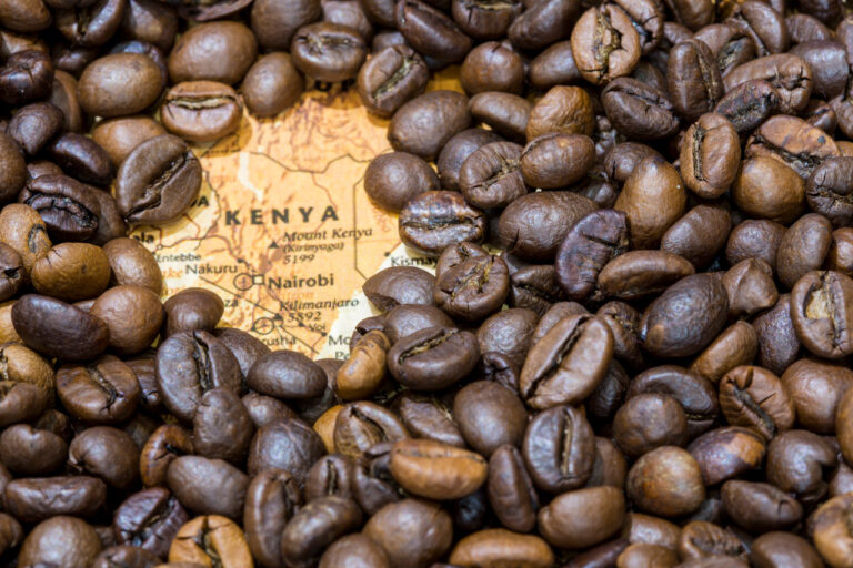 Map of Kenya under a background of coffee beans