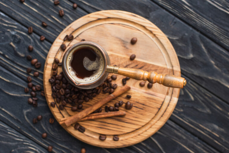 How to Dissolve Cinnamon in Coffee cezve with coffee and cinnamon sticks