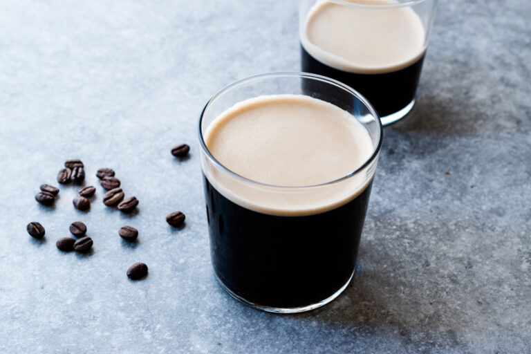 frothy nitro cold brew coffee with beans