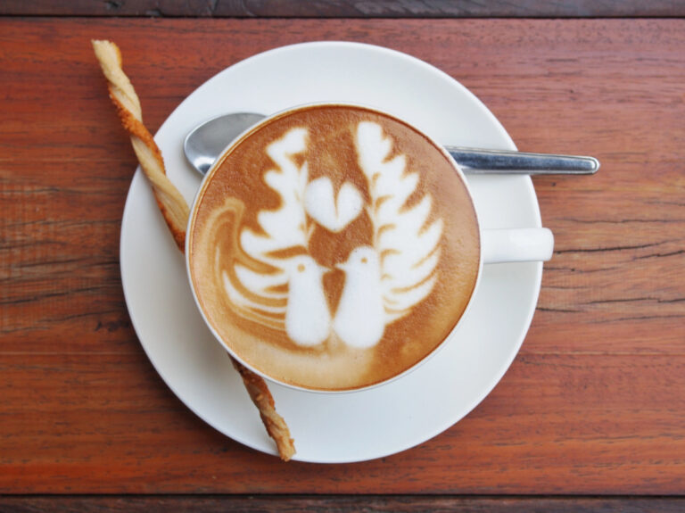 two birds with a heart latte art